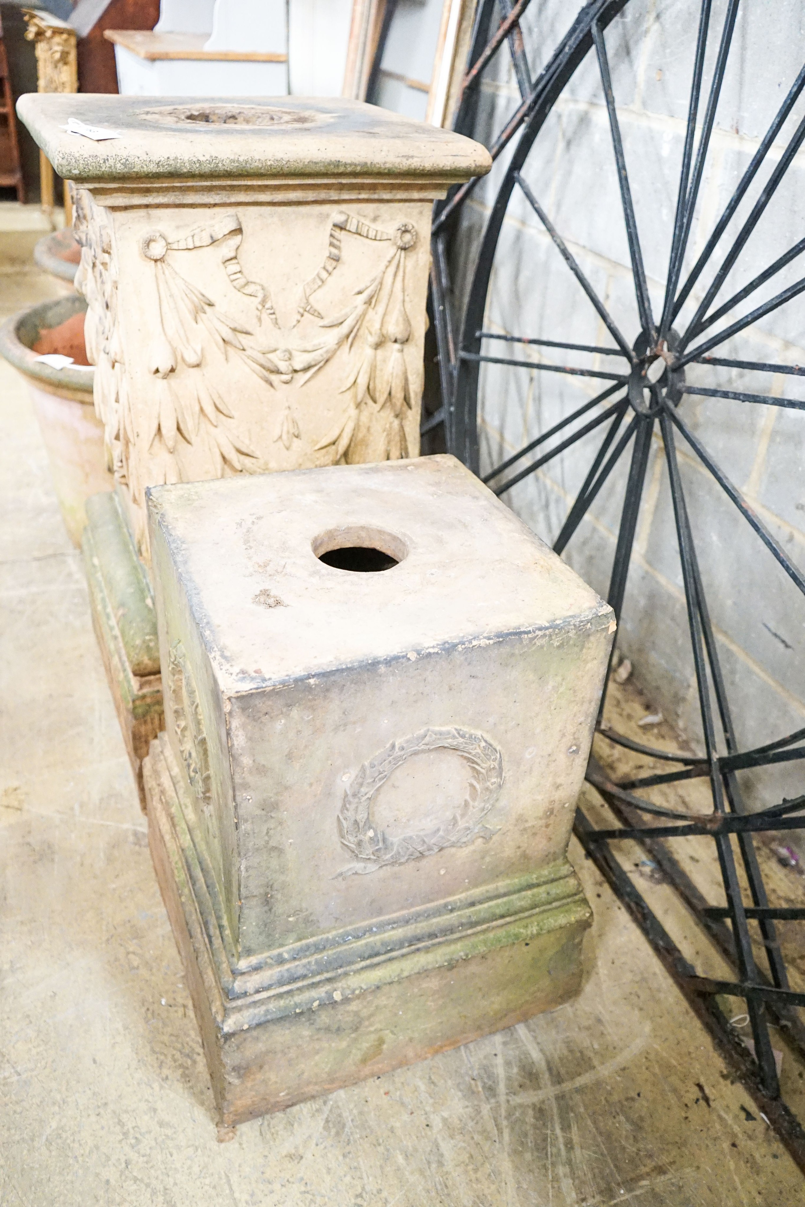 Two moulded terracotta garden pedestals, larger height 92cm